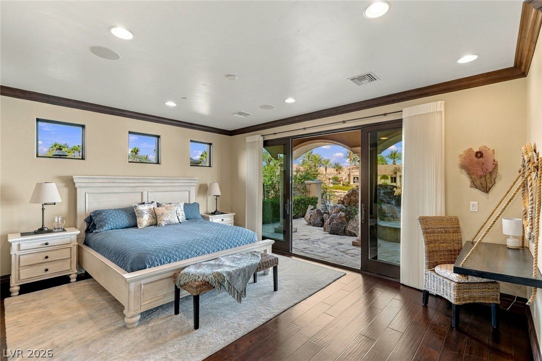 7 Lido Nord, Henderson, NV 89011 Rich hardwood floors and elegant crown molding frame a spacious suite opening to a stone patio.