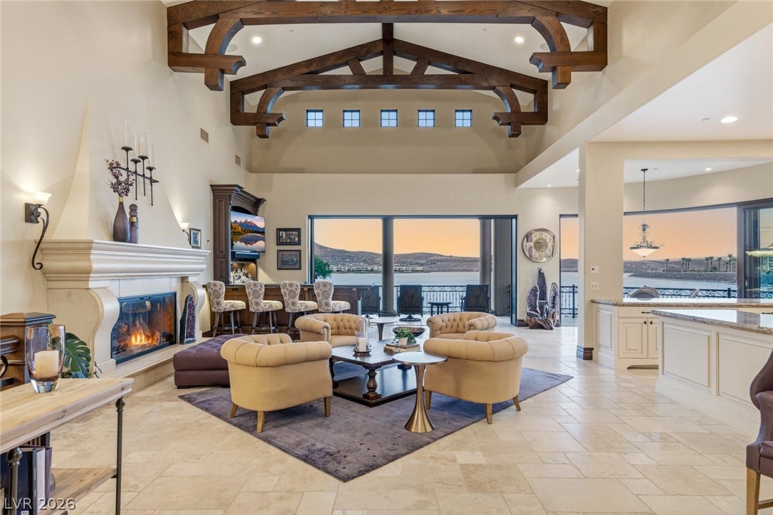 7 Lido Nord, Henderson, NV 89011 Massive exposed timber trusses crown an airy open living space overlooking serene water views.
