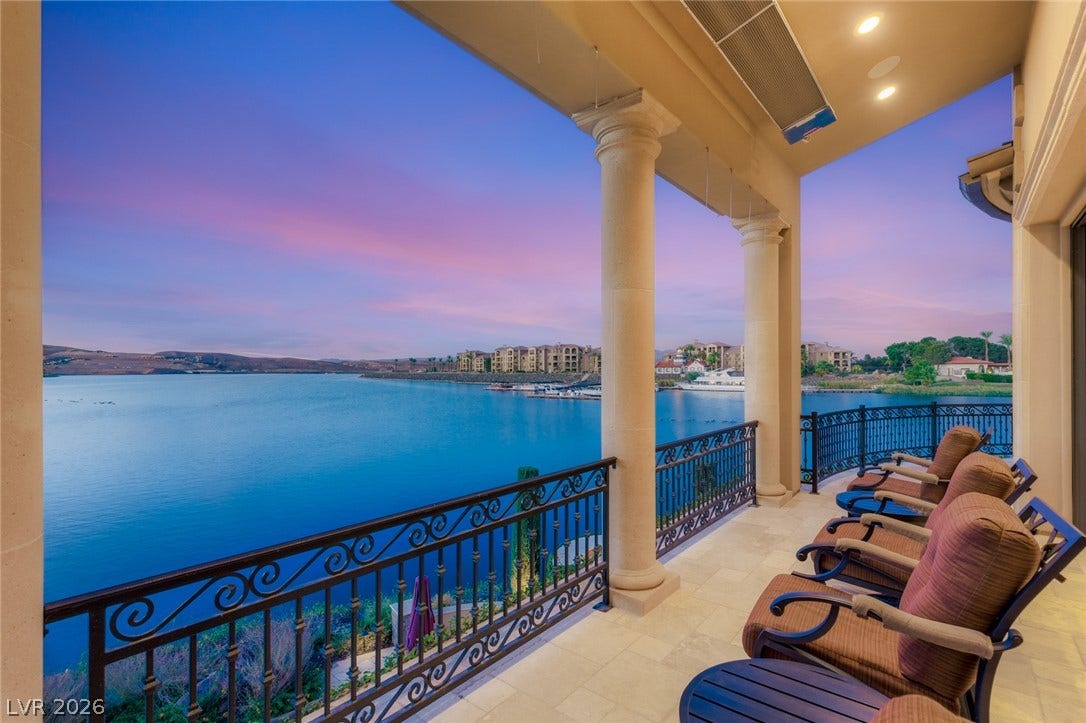 7 Lido Nord, Henderson, NV 89011 Stately stone columns frame sweeping waterfront vistas from a covered upper-level terrace.