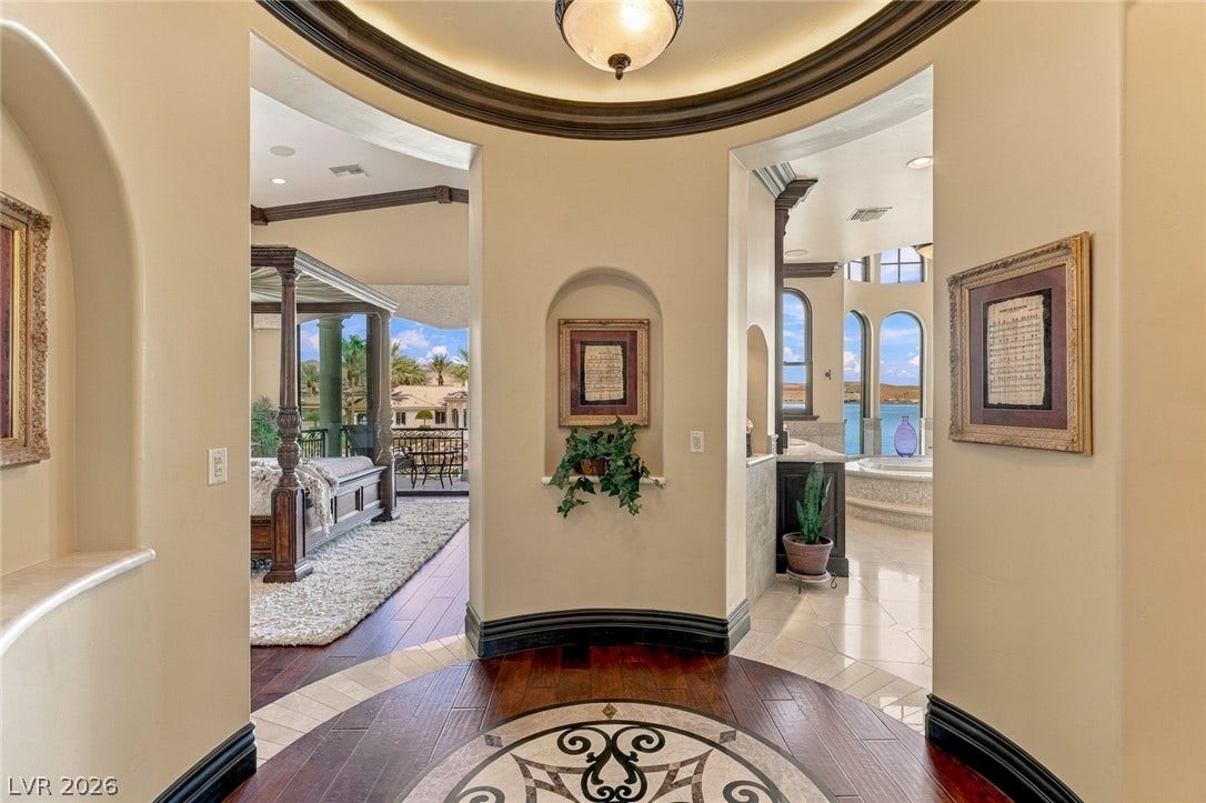 7 Lido Nord, Henderson, NV 89011 A dramatic rotunda foyer showcases intricate wood and tile flooring leading to multiple wings.