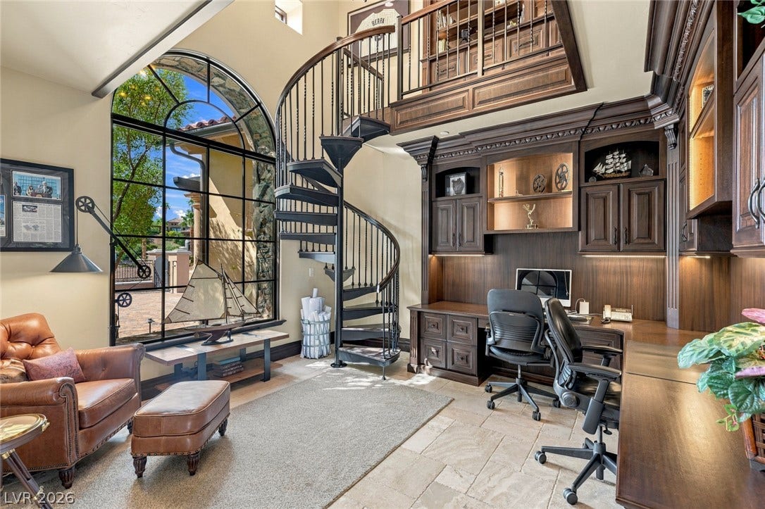 7 Lido Nord, Henderson, NV 89011 Custom built-ins and a striking spiral staircase define this double-height office sanctuary.