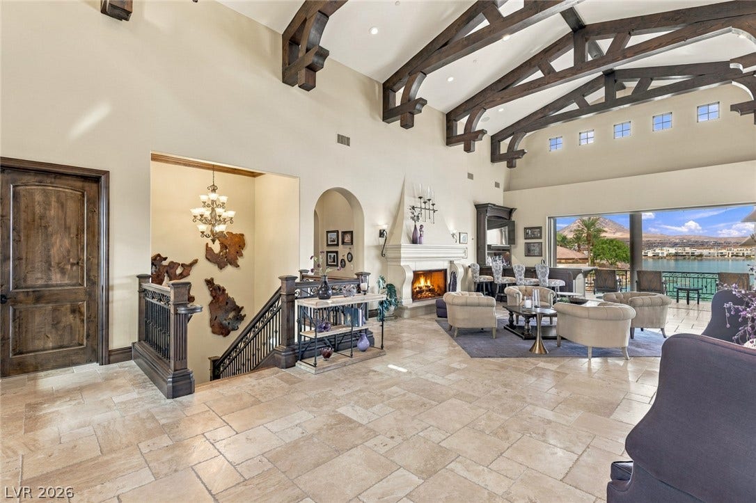 7 Lido Nord, Henderson, NV 89011 Soaring beamed ceilings and stone flooring frame sweeping views of the water.