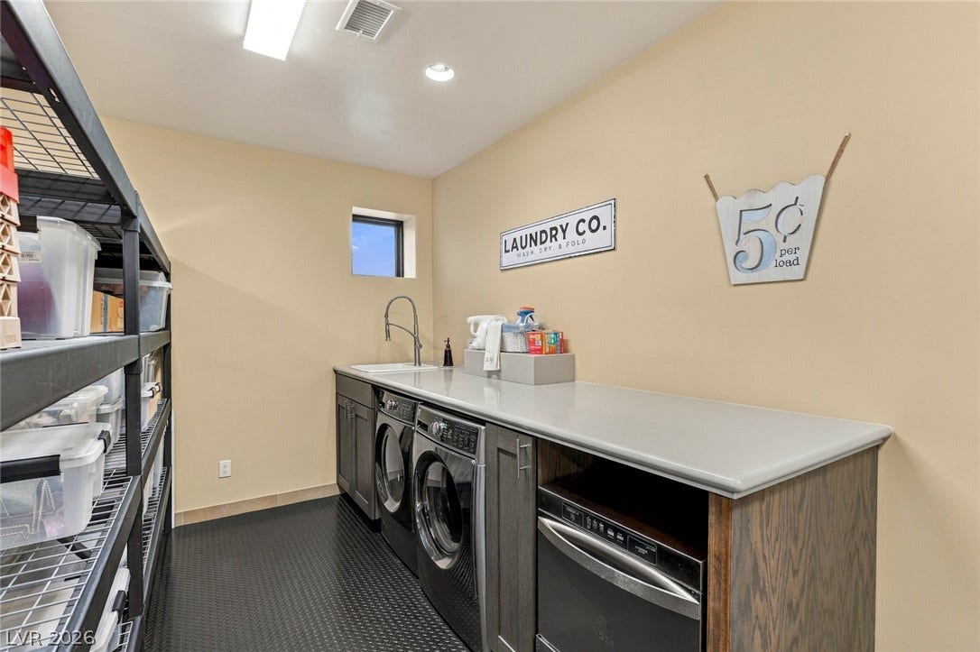 7 Lido Nord, Henderson, NV 89011 Ample counter space and a built-in sink highlight this highly functional home utility area.