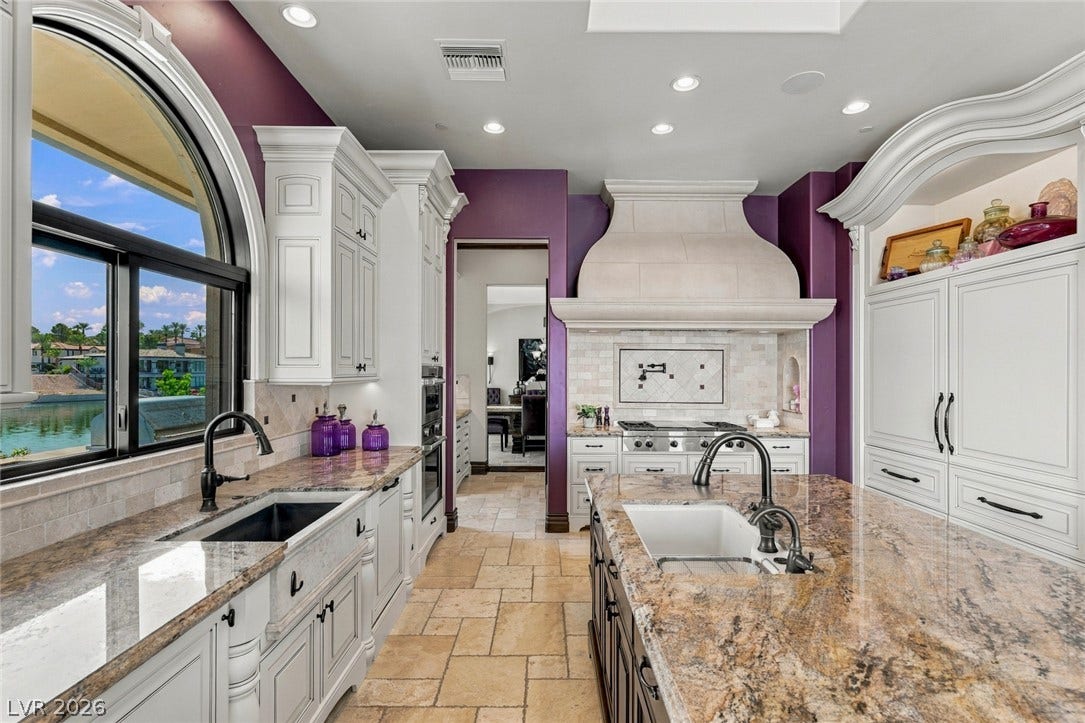 7 Lido Nord, Henderson, NV 89011 Gleaming stone countertops and fine cabinetry define this custom kitchen space.