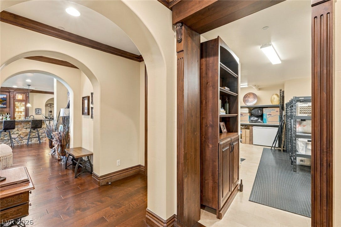 7 Lido Nord, Henderson, NV 89011 Rich hardwood floors and elegant arched doorways create a seamless flow between rooms.