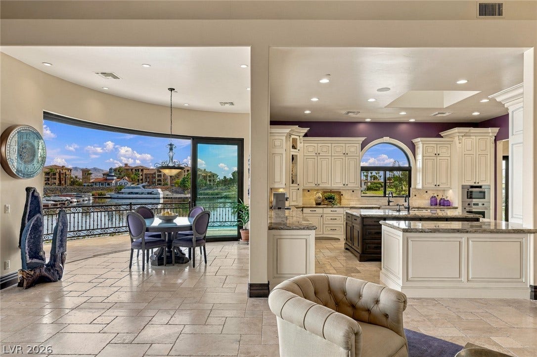 7 Lido Nord, Henderson, NV 89011 Polished tile floors flow seamlessly through this open-concept layout framing scenic water views.