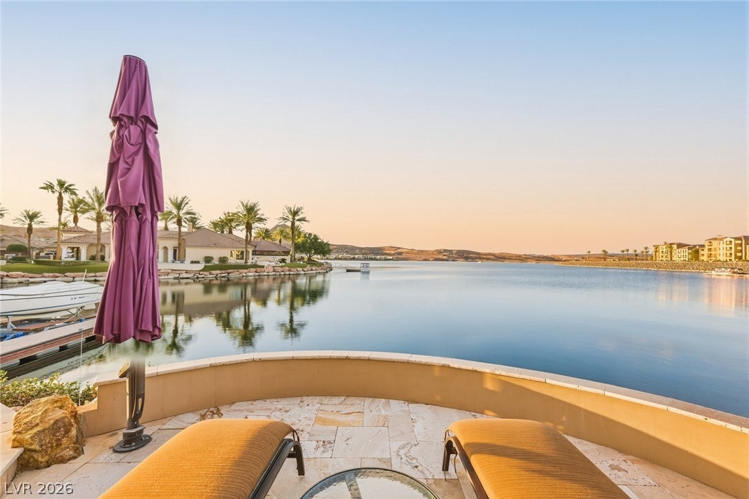 7 Lido Nord, Henderson, NV 89011 Calm, expansive water views stretch out from this private stone-tiled patio.