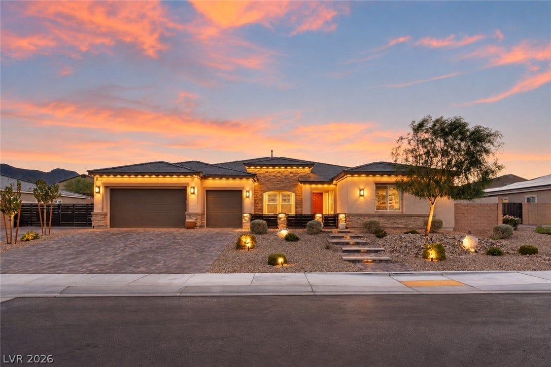 5475 Grambley Street, Las Vegas, NV 89149 Custom stone accents and professional desert landscaping frame this exceptional single-level residence.