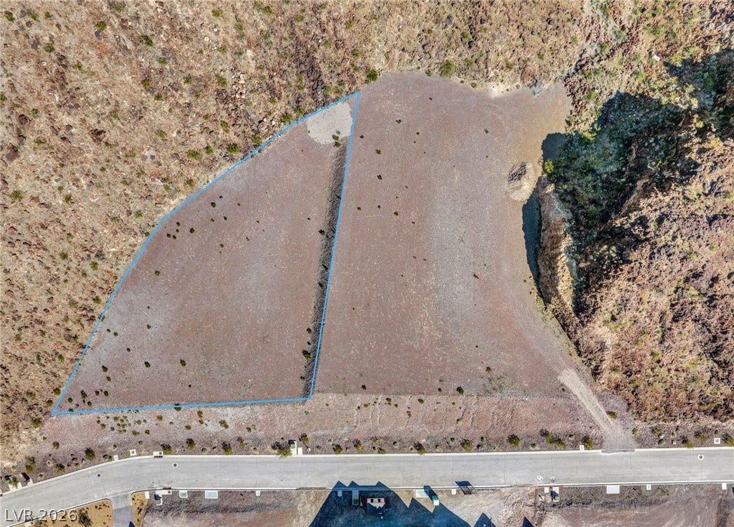 22 Rockstream Drive, Henderson, NV 89012 Vast desert parcels offer an exceptional building site surrounded by rugged mountain terrain.