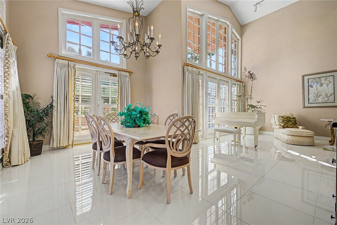 1105 Broadmoor Avenue, Las Vegas, NV 89109 Gleaming tile floors complement the soaring double-height ceilings and tall multi-tier windows.