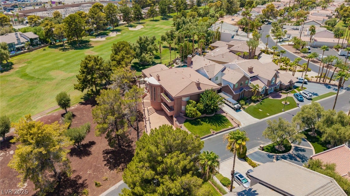 1105 Broadmoor Avenue, Las Vegas, NV 89109 Mature trees and a manicured golf course border this multi-level residential neighborhood.