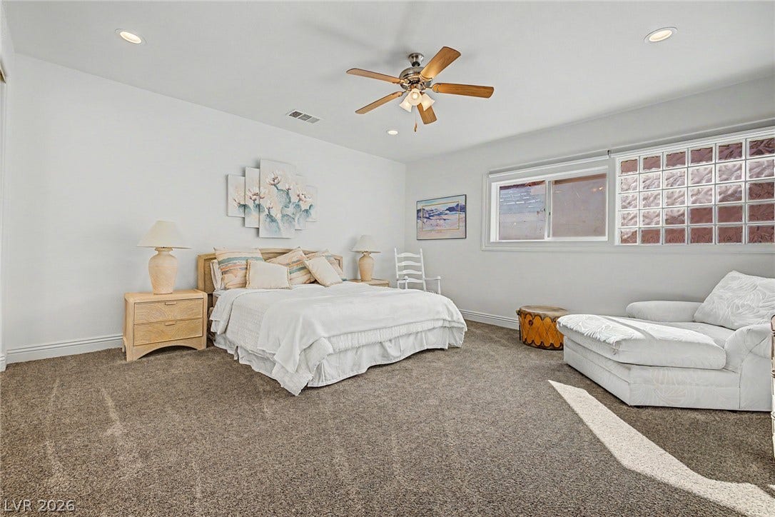 1105 Broadmoor Avenue, Las Vegas, NV 89109 Recessed lighting and thick carpeting define this comfortable, airy sleeping space.