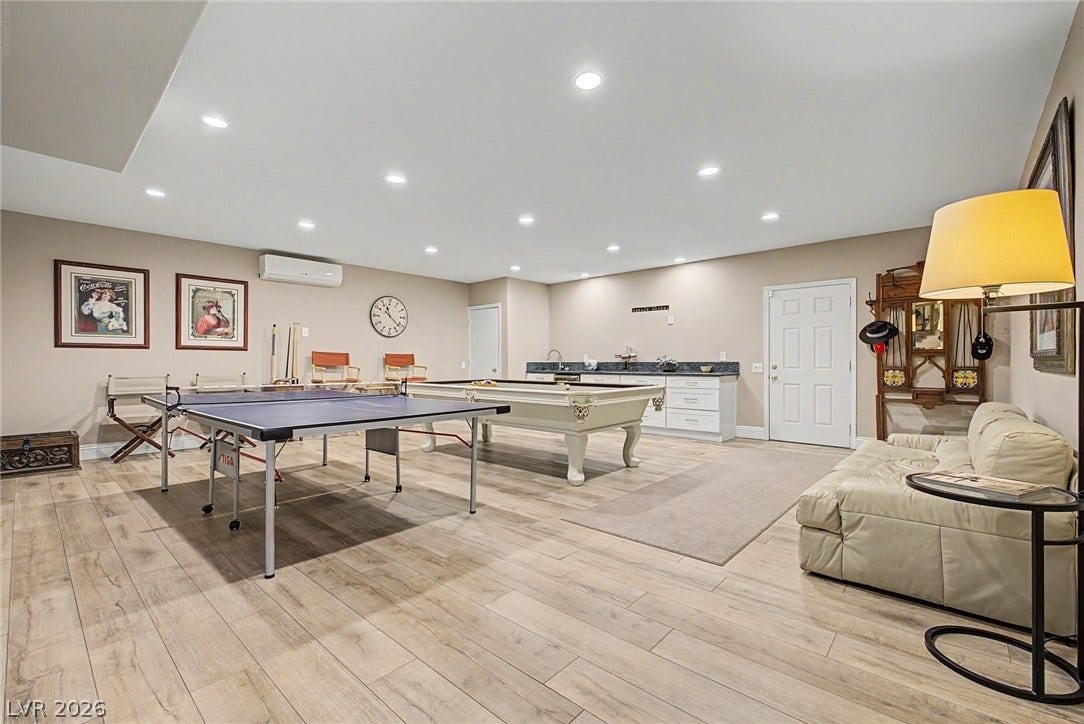 1105 Broadmoor Avenue, Las Vegas, NV 89109 Recessed lighting illuminates this versatile recreation room finished with handsome plank flooring.