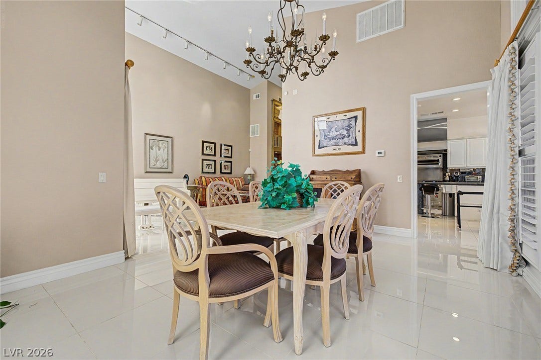 1105 Broadmoor Avenue, Las Vegas, NV 89109 High ceilings and polished tile flooring elevate this elegant formal dining area.