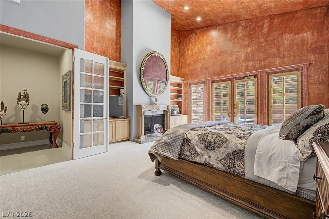 1105 Broadmoor Avenue, Las Vegas, NV 89109 Dramatic high ceilings and a cozy fireplace define this unique main level bedroom retreat.