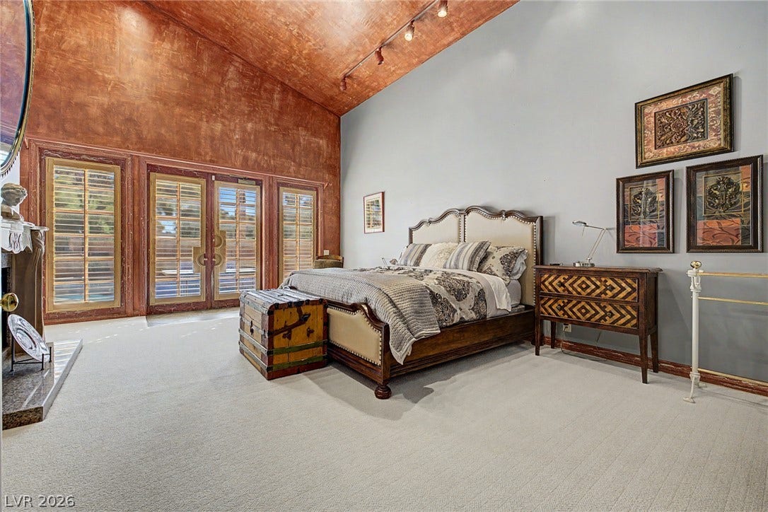 1105 Broadmoor Avenue, Las Vegas, NV 89109 A dramatic vaulted ceiling soaring over carpeted floors creates an airy sanctuary.