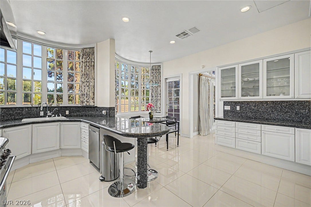 1105 Broadmoor Avenue, Las Vegas, NV 89109 Polished tile flooring and curved bay windows frame this elegant culinary space.