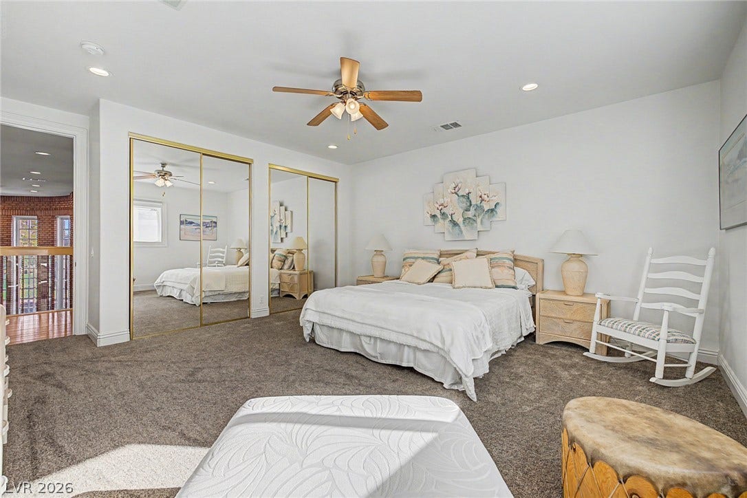 1105 Broadmoor Avenue, Las Vegas, NV 89109 A spacious bedroom features neutral carpeting, recessed lighting, and mirrored closet doors.