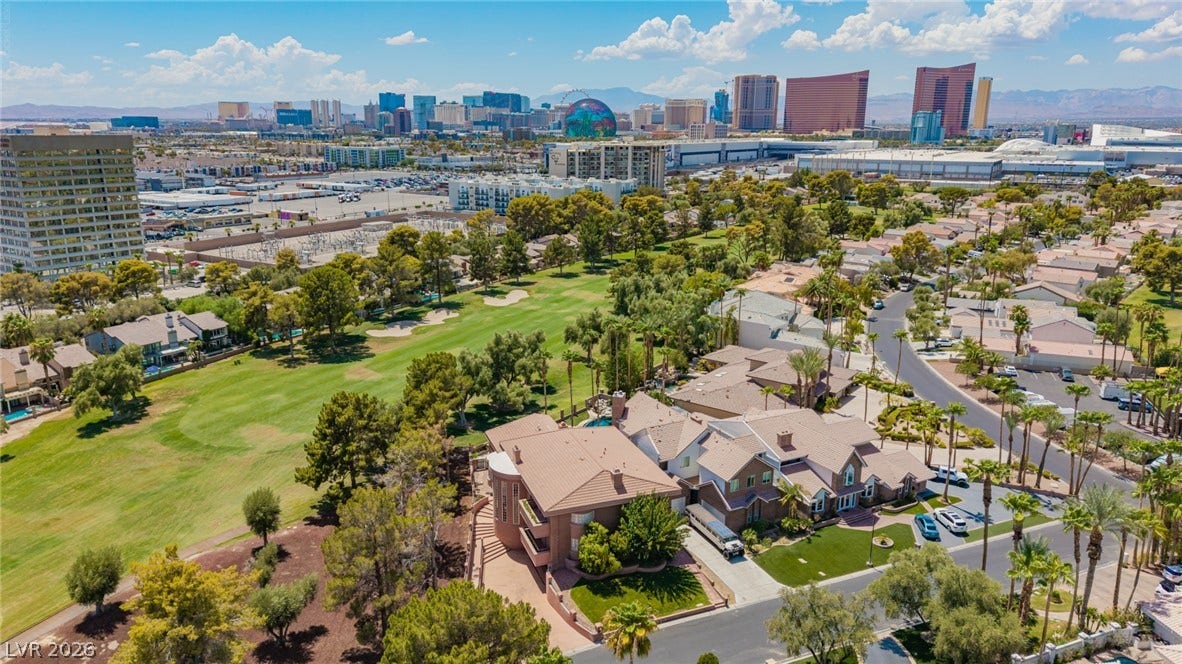 1105 Broadmoor Avenue, Las Vegas, NV 89109 Panoramic mountain and skyline views overlook a manicured golf course in a prime location.