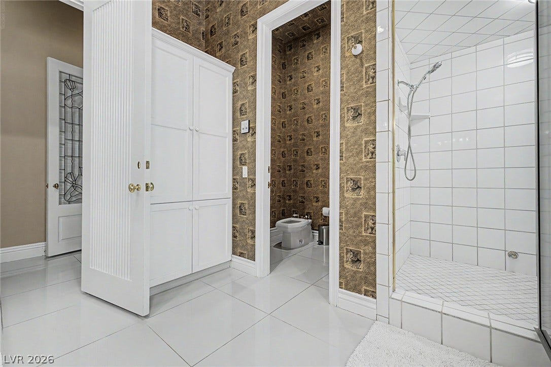 1105 Broadmoor Avenue, Las Vegas, NV 89109 Polished tile flooring and a walk-in shower define this functional bathroom layout.