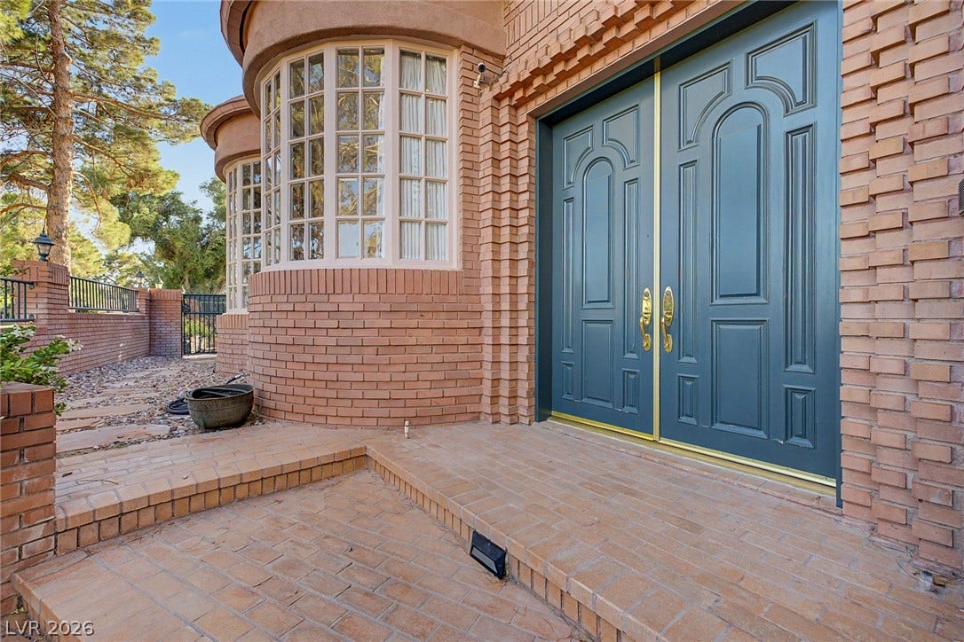 1105 Broadmoor Avenue, Las Vegas, NV 89109 Substantial double entry doors and classic brickwork create a commanding and memorable first impression.