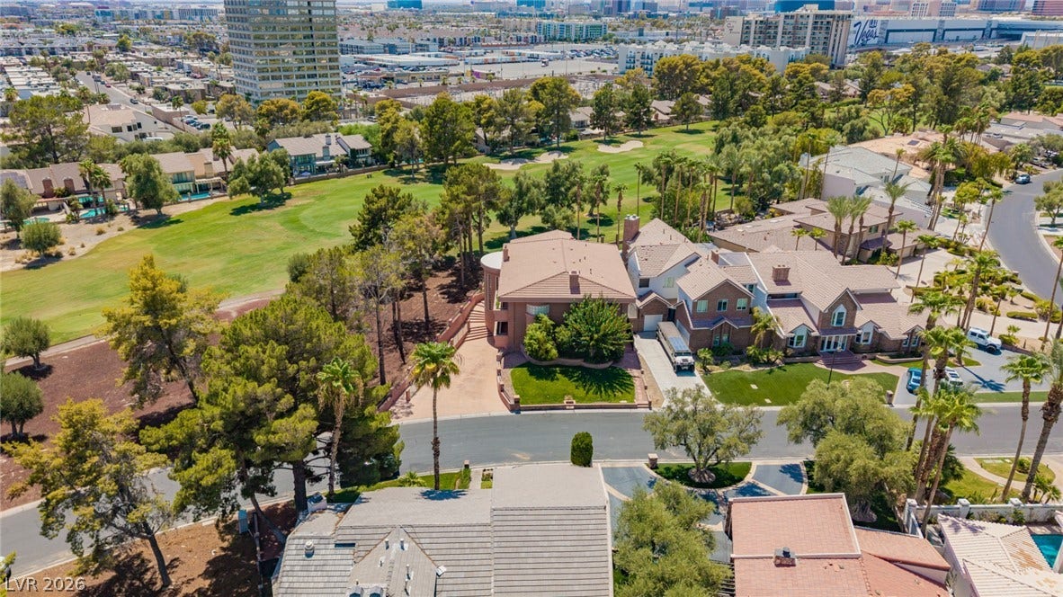 1105 Broadmoor Avenue, Las Vegas, NV 89109 An aerial perspective showcases an established neighborhood bordering a lush green golf course.