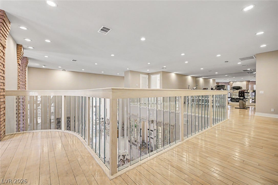 1105 Broadmoor Avenue, Las Vegas, NV 89109 Polished wood floors and modern glass railings define this versatile second-story loft space.