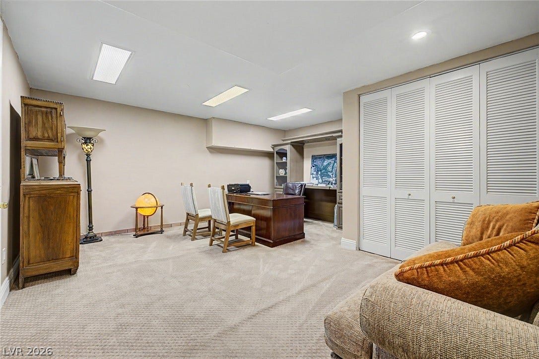 1105 Broadmoor Avenue, Las Vegas, NV 89109 Louvered closet doors and neutral carpeting anchor this functional home workspace.