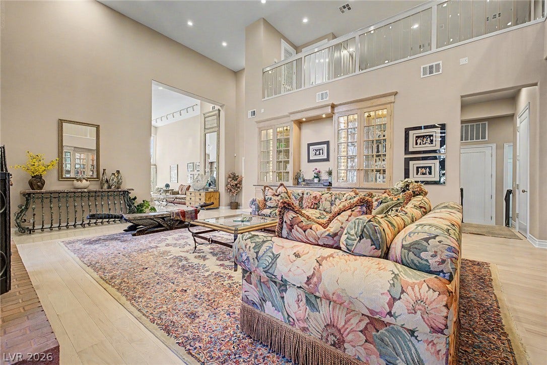1105 Broadmoor Avenue, Las Vegas, NV 89109 Towering ceilings and custom built-in cabinetry define this light-filled, open-concept living space.