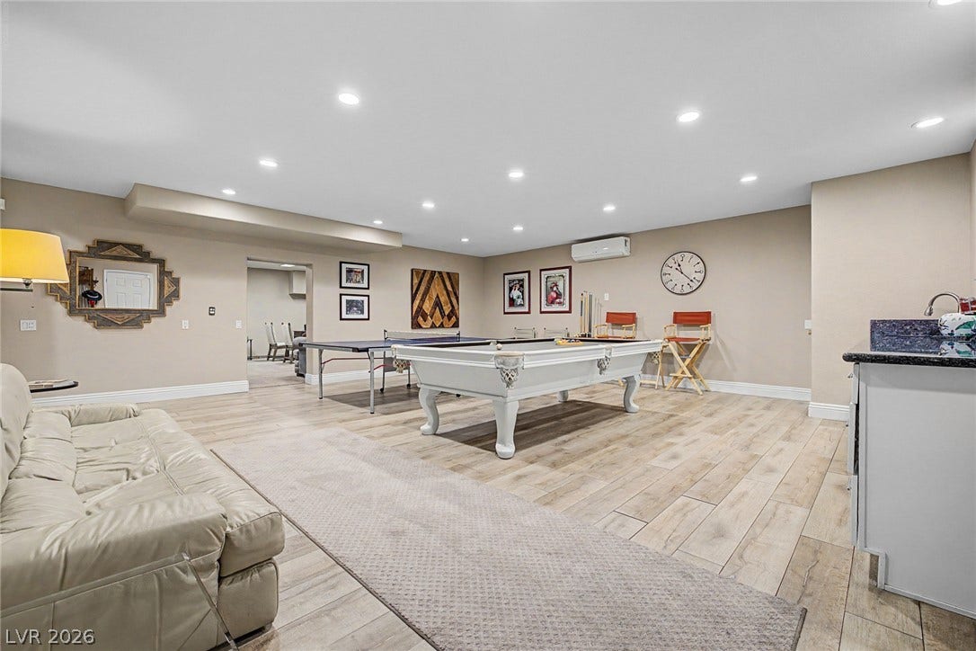1105 Broadmoor Avenue, Las Vegas, NV 89109 Recessed lighting illuminates this versatile recreation space finished with durable wood-look flooring.