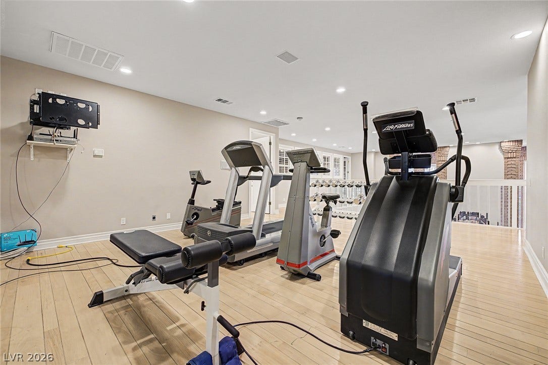 1105 Broadmoor Avenue, Las Vegas, NV 89109 Smooth wood floors and recessed lighting enhance this upper-level fitness space.