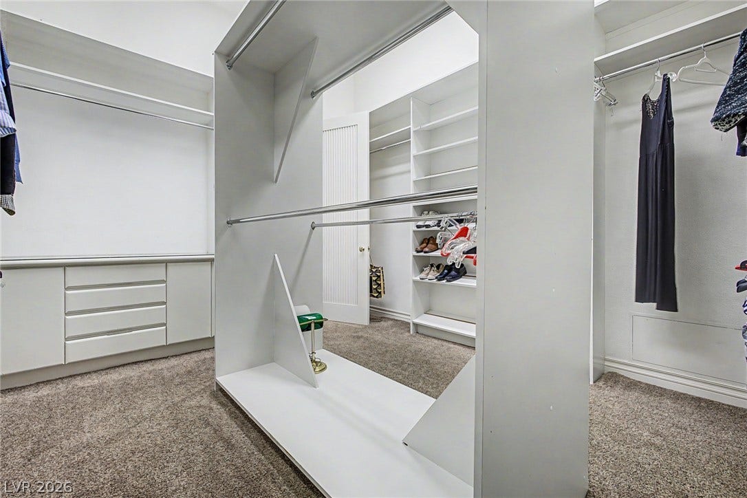 1105 Broadmoor Avenue, Las Vegas, NV 89109 An organized walk-in closet includes customized shelving and built-in drawer units.