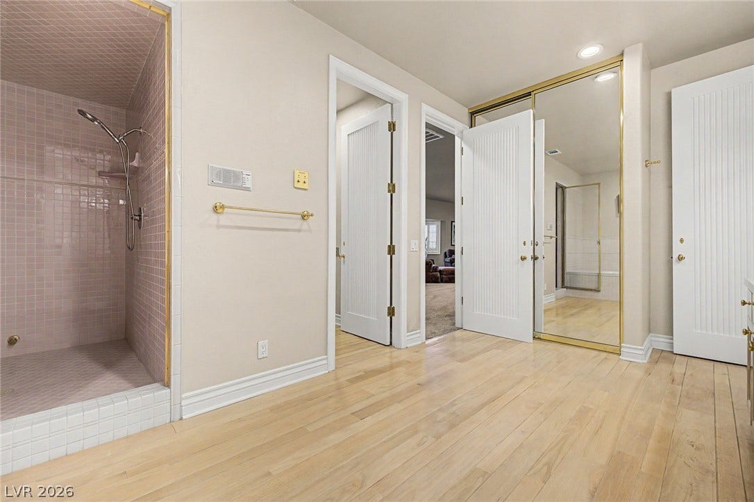 1105 Broadmoor Avenue, Las Vegas, NV 89109 Smooth wood floors and crisp crown molding frame this functional bathroom suite.