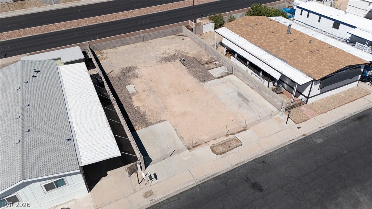 3499 Allegheny Drive, Las Vegas, NV 89122 A cleared residential lot with perimeter walls is ready for development.