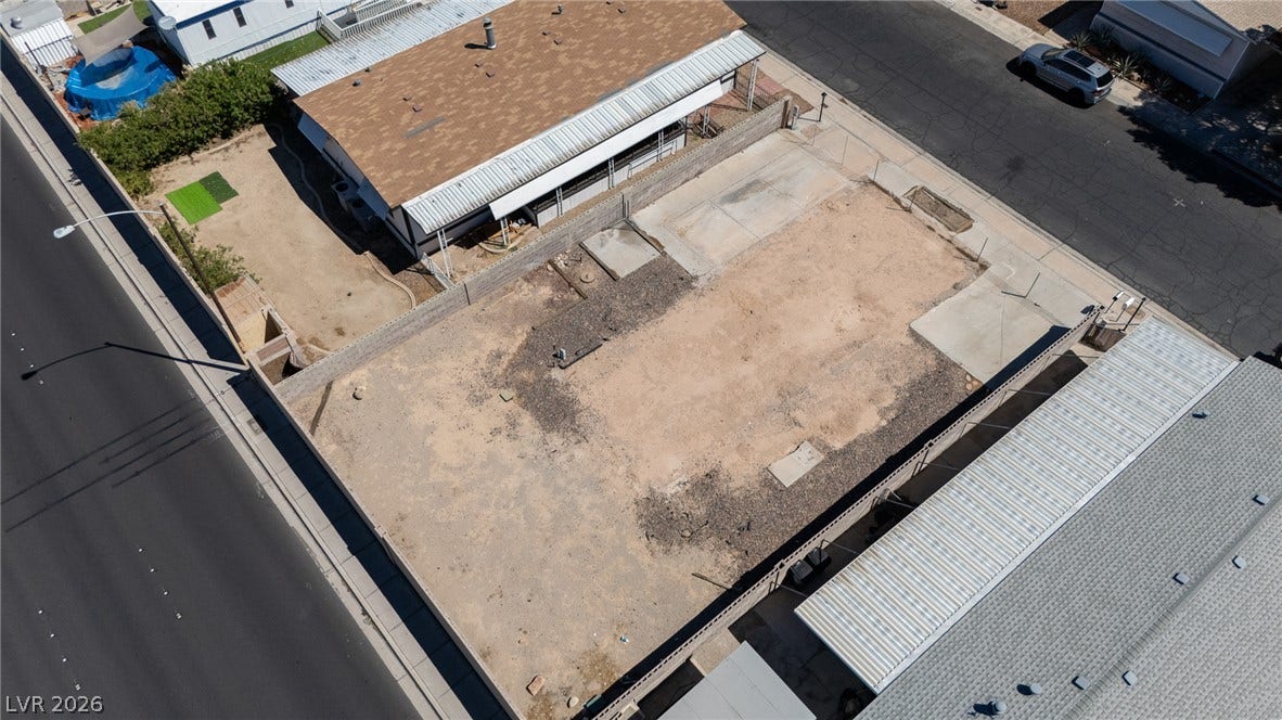 3499 Allegheny Drive, Las Vegas, NV 89122 An aerial perspective showcases a spacious cleared lot ready for future development.