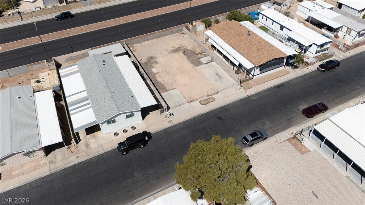 3499 Allegheny Drive, Las Vegas, NV 89122 An aerial perspective showcases a vacant residential lot ready for development in a quiet neighborhood.