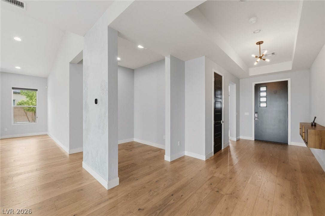 8380 Mojave Creek Court, Las Vegas, NV 89113 Warm hardwood floors and clean architectural lines define this welcoming entryway.