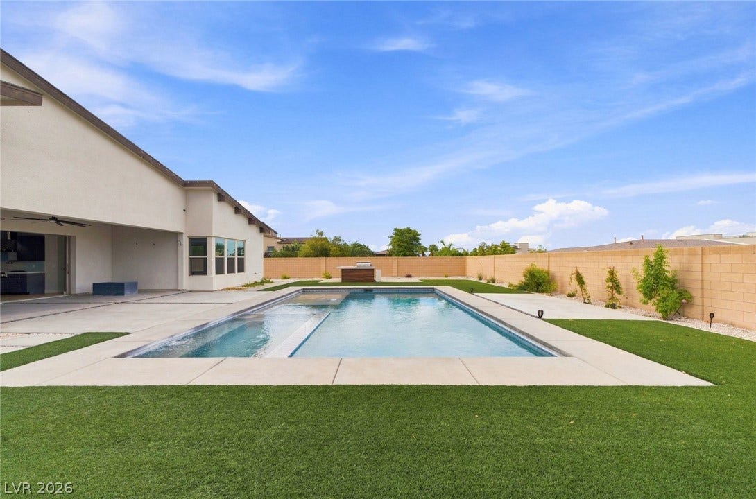 8380 Mojave Creek Court, Las Vegas, NV 89113 An inviting swimming pool and spa anchor this spacious backyard framed by privacy walls.