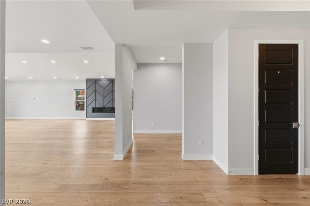 8380 Mojave Creek Court, Las Vegas, NV 89113 Gleaming hardwood floors and recessed lighting enhance this airy, open-concept living space.