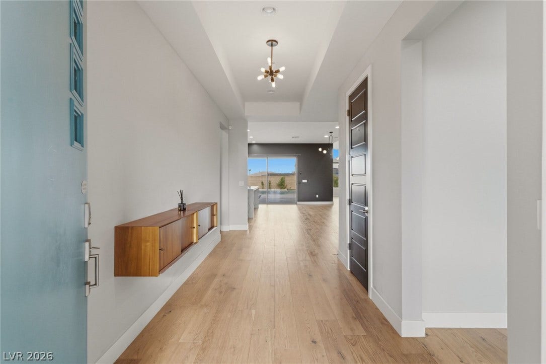8380 Mojave Creek Court, Las Vegas, NV 89113 An inviting entry foyer guides guests directly into the light-filled main living space.