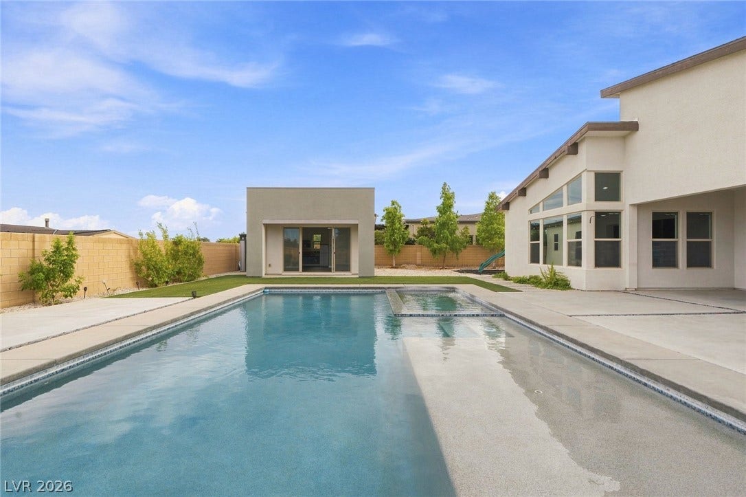 8380 Mojave Creek Court, Las Vegas, NV 89113 An inviting swimming pool and detached pool house anchor this spacious backyard oasis.