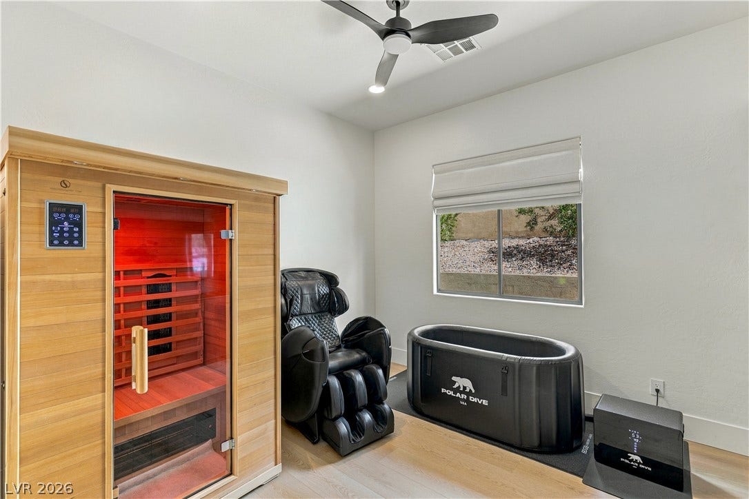 40 Stonemark Drive, Henderson, NV 89052 Smooth wood floors and a sliding window frame this dedicated home wellness room.