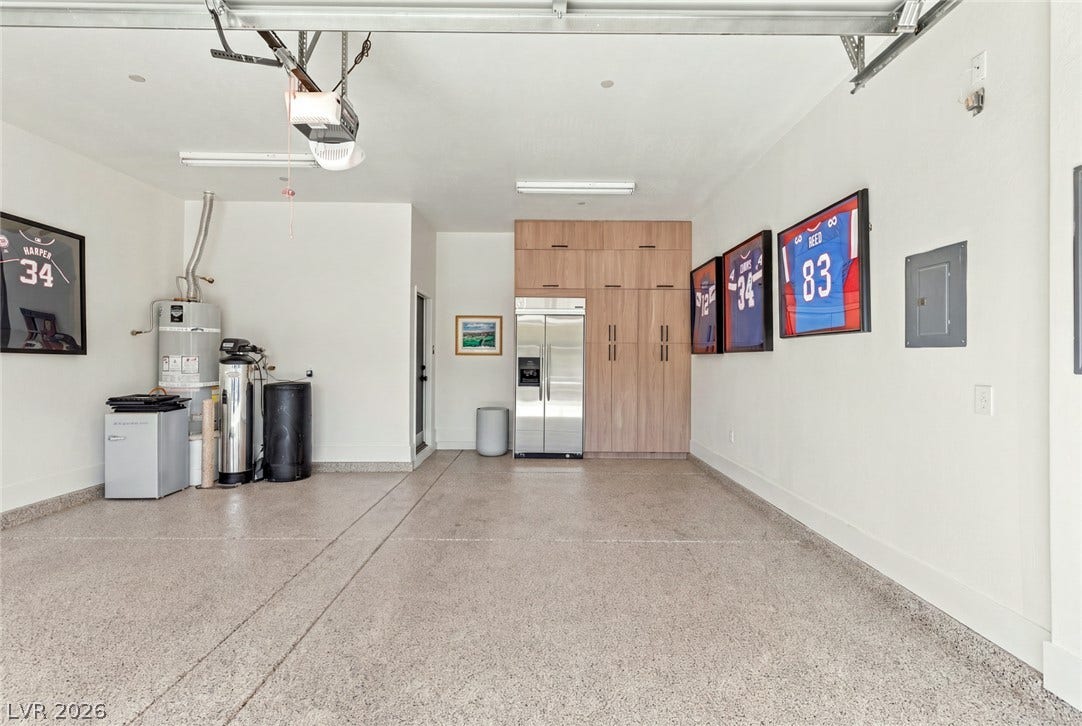 40 Stonemark Drive, Henderson, NV 89052 An immaculate three-car garage boasts finished concrete floors and extensive built-in storage cabinets.