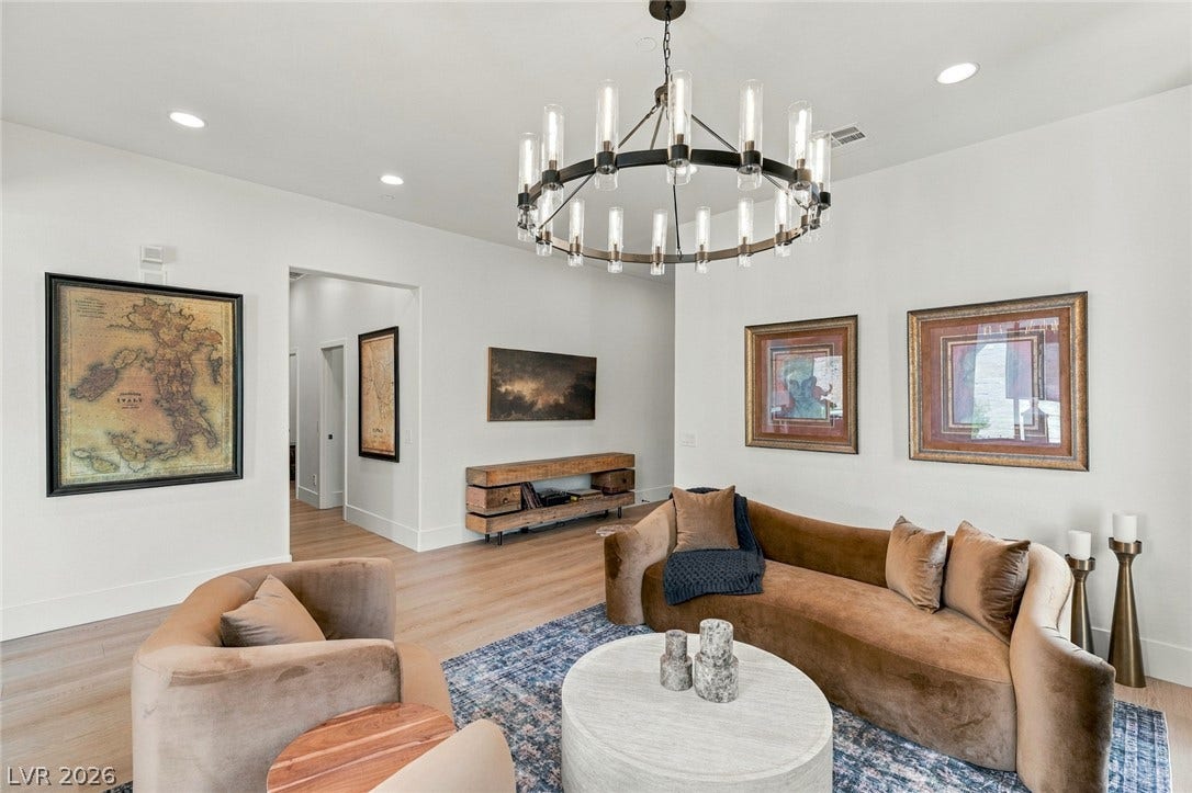 40 Stonemark Drive, Henderson, NV 89052 Smooth hardwood floors and recessed lighting anchor this inviting modern living space.