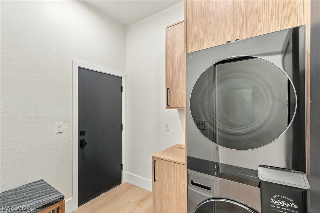 40 Stonemark Drive, Henderson, NV 89052 Streamlined laundry area highlights flat-panel cabinetry paired with warm wood flooring.