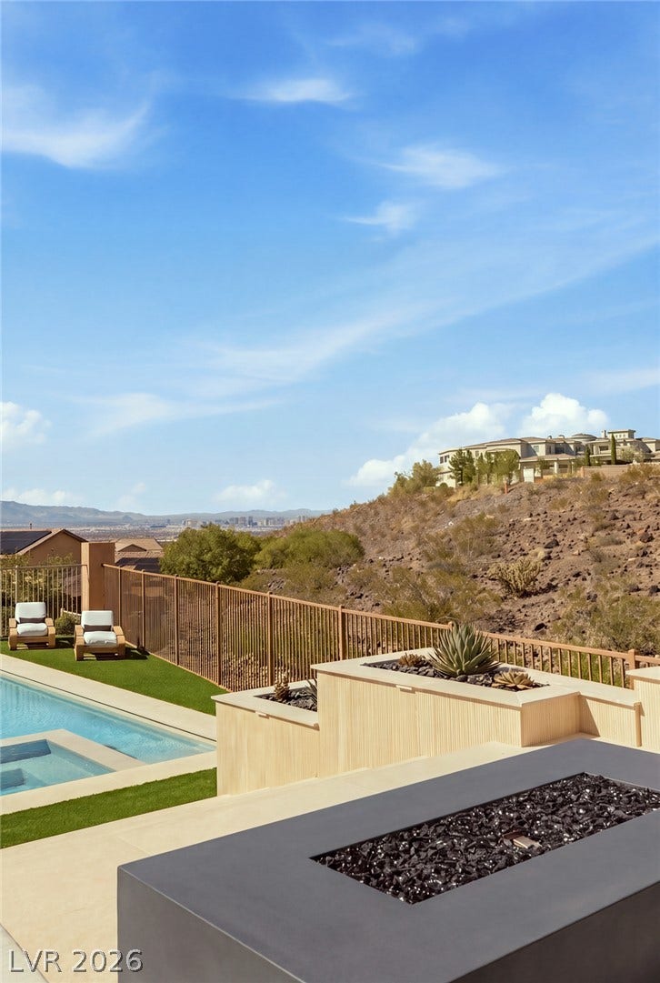 40 Stonemark Drive, Henderson, NV 89052 An elevated poolside terrace commands sweeping neighborhood and desert hillside views.