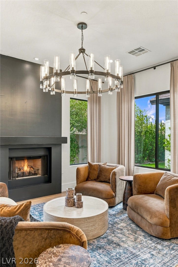 40 Stonemark Drive, Henderson, NV 89052 A modern fireplace serves as the centerpiece of this inviting living room.