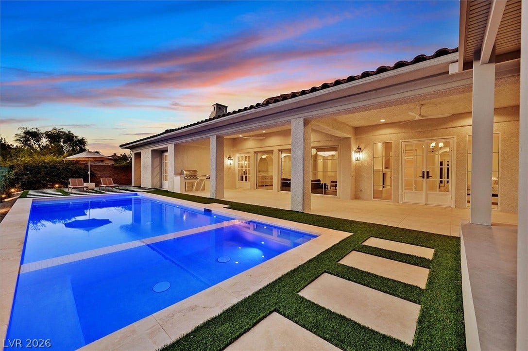 12007 Oakland Hills Drive, Las Vegas, NV 89141 An inviting swimming pool and spa highlight the spacious covered patio of this home.
