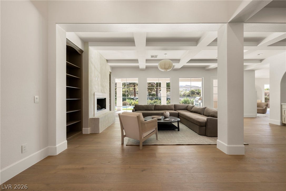 12007 Oakland Hills Drive, Las Vegas, NV 89141 An open concept floor plan connects the main spaces under detailed coffered ceilings.