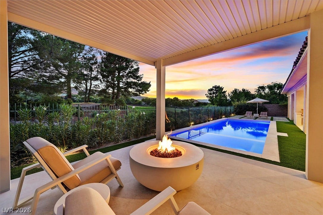 12007 Oakland Hills Drive, Las Vegas, NV 89141 An inviting covered patio steps out to a pristine pool and backyard oasis.